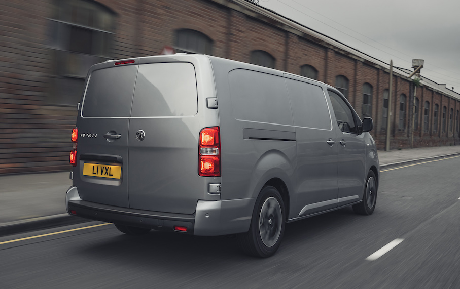 Vauxhall Vivaro e electric van exterior rear driving in city